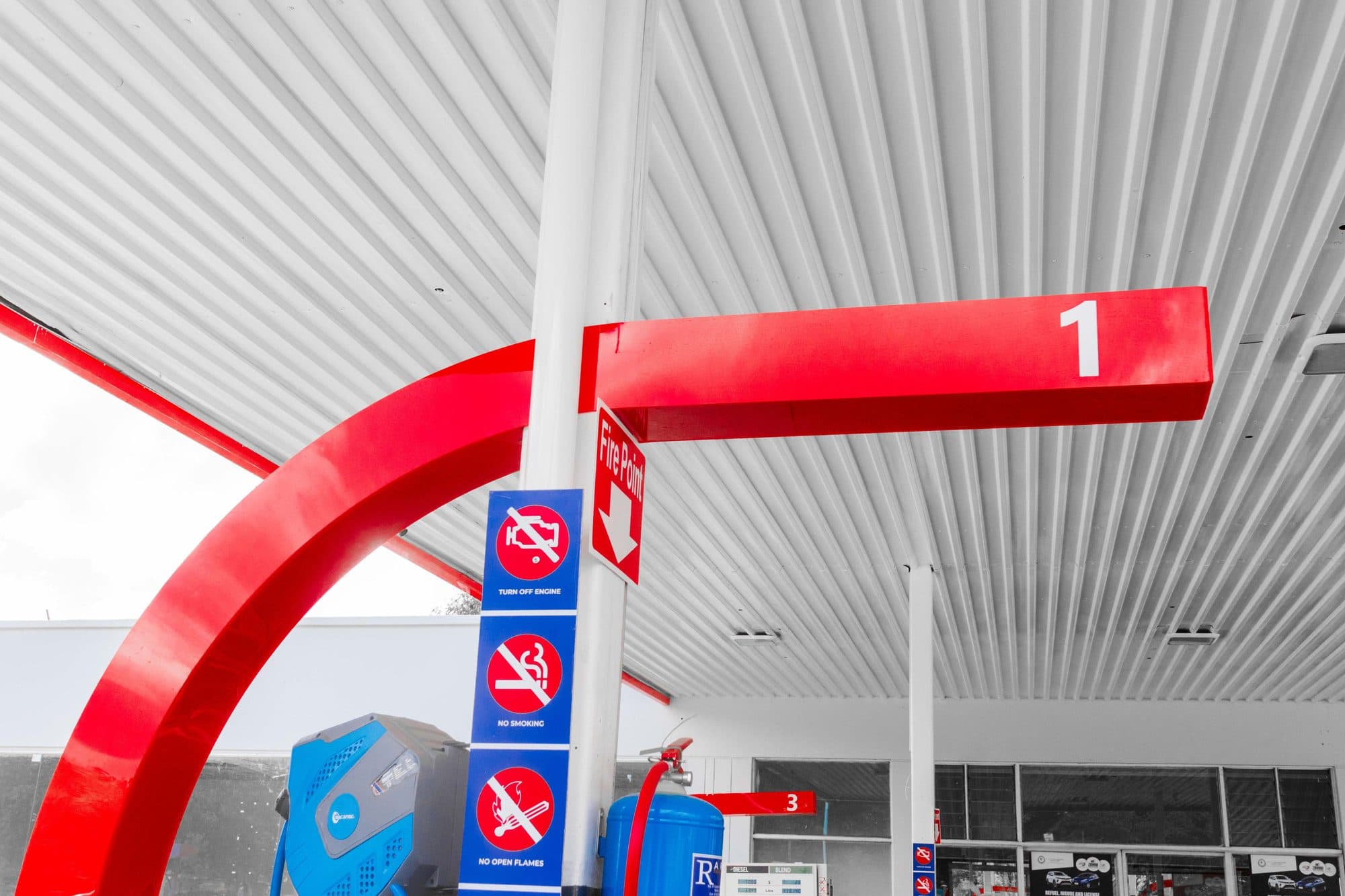Red canopy arm meeting the ceiling, crisp line work